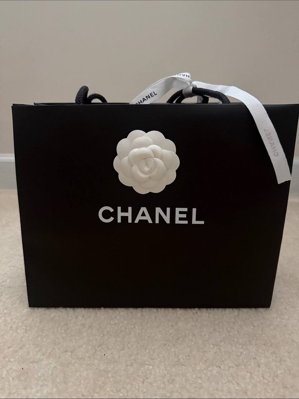 CHANEL Black Shopping Bag with White Camellia and Ribbon